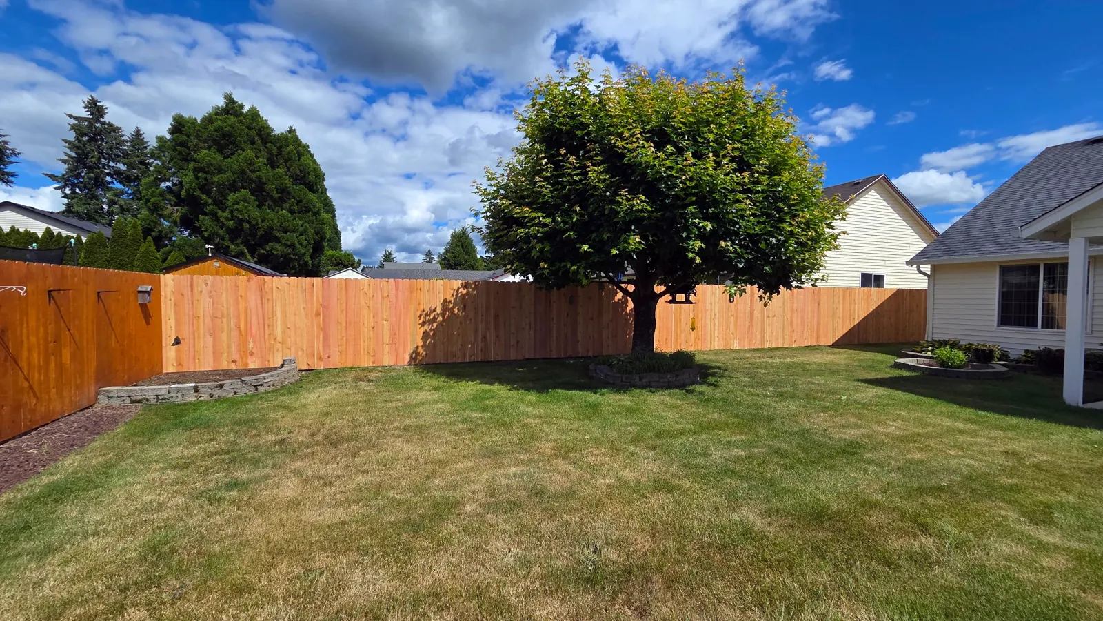 New cedar privacy fence installed by Ursus Construction