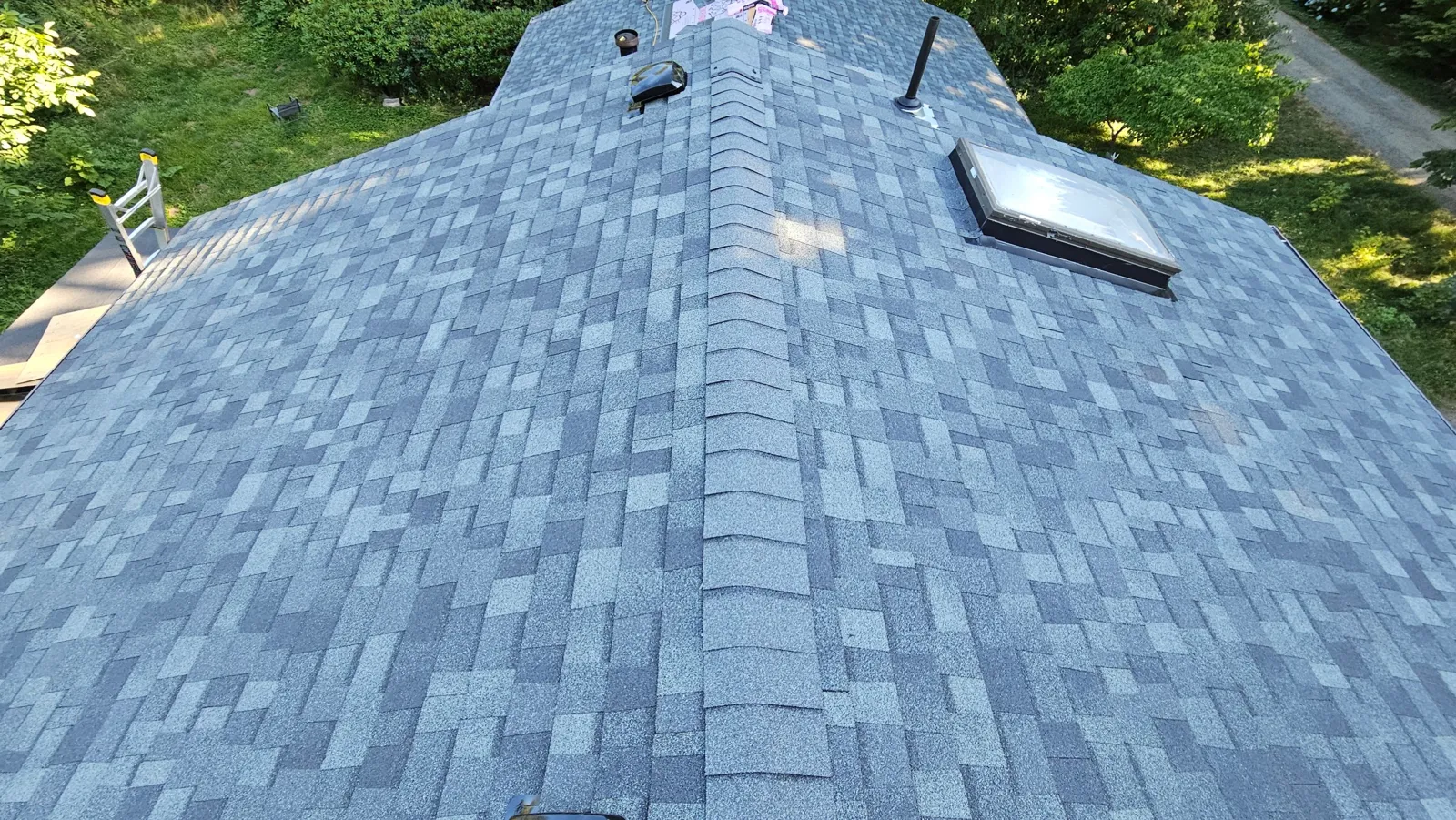 New shingle roof on a house by Ursus Construction