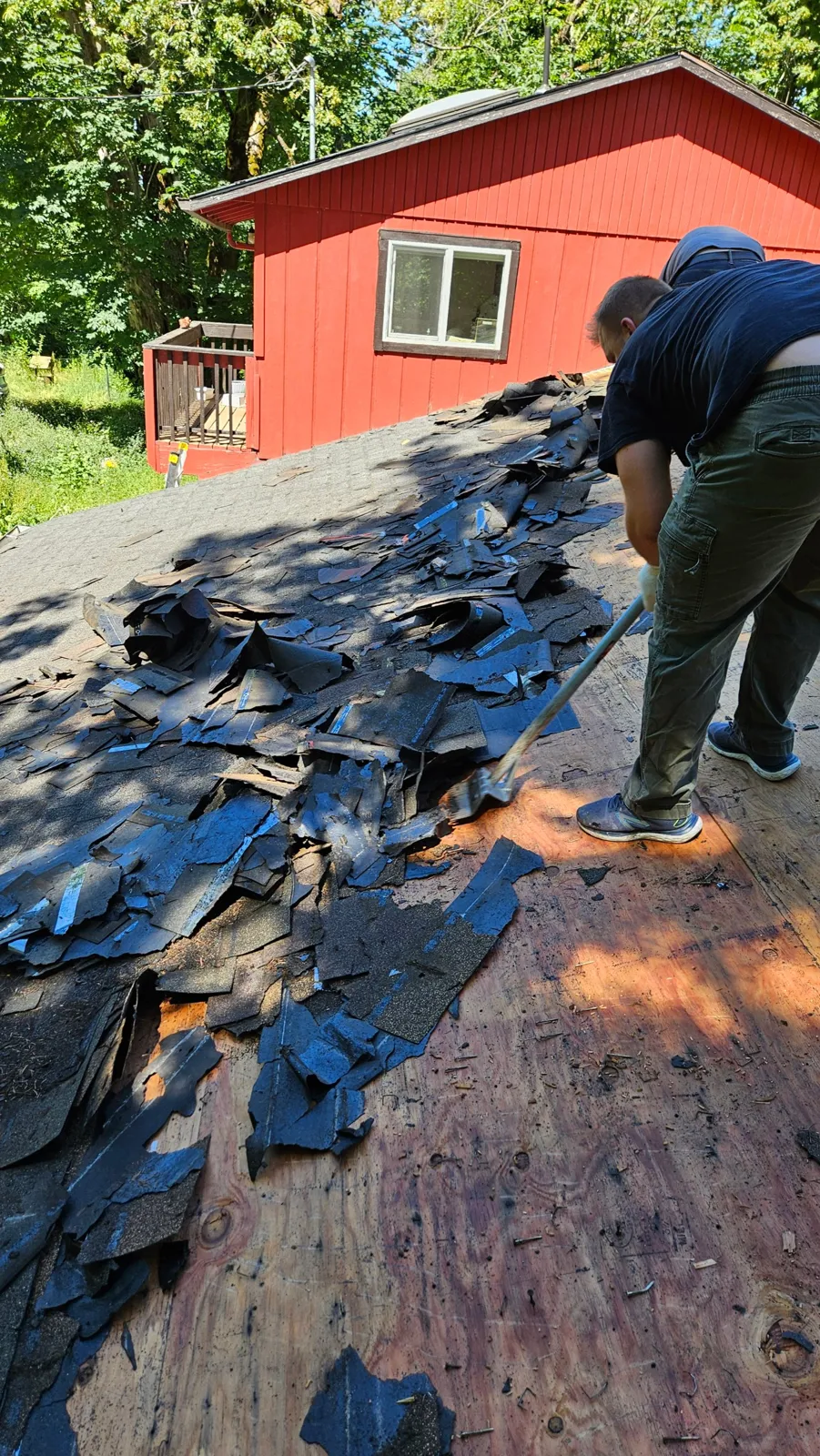 Before: old shingles torn off down to the roof deck
