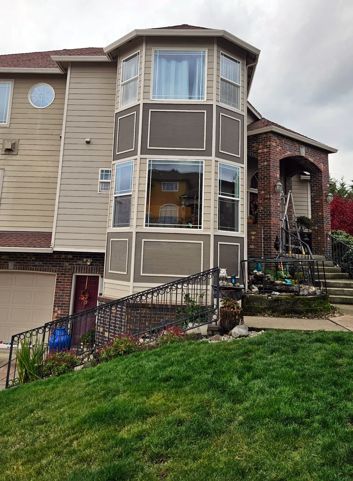 After: bay window wall rebuilt with new siding