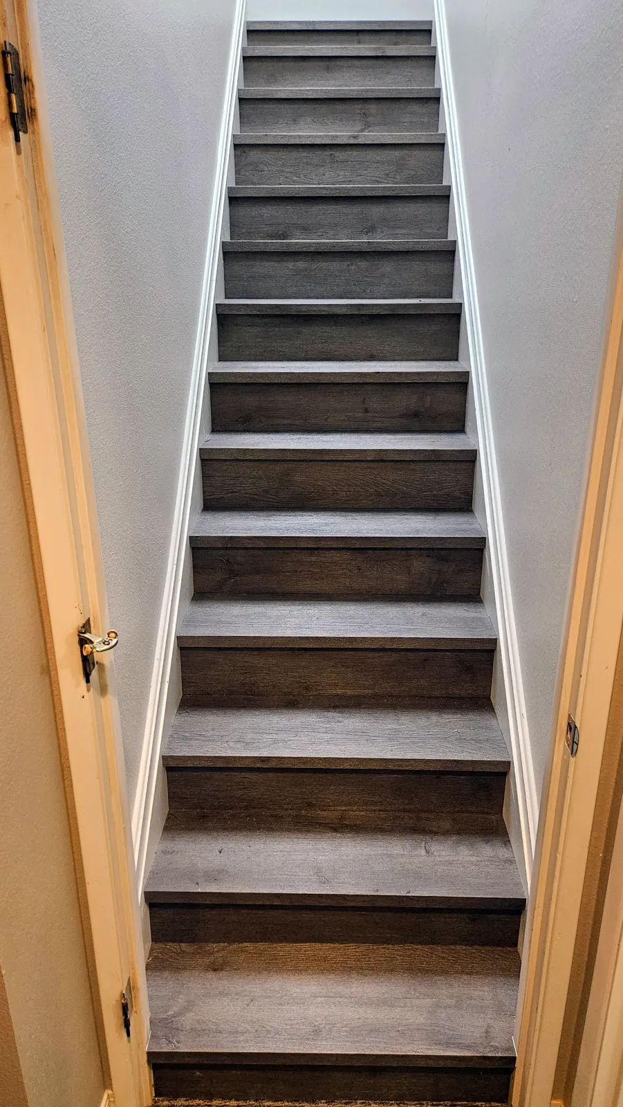 Staircase refinished with vinyl plank treads and risers