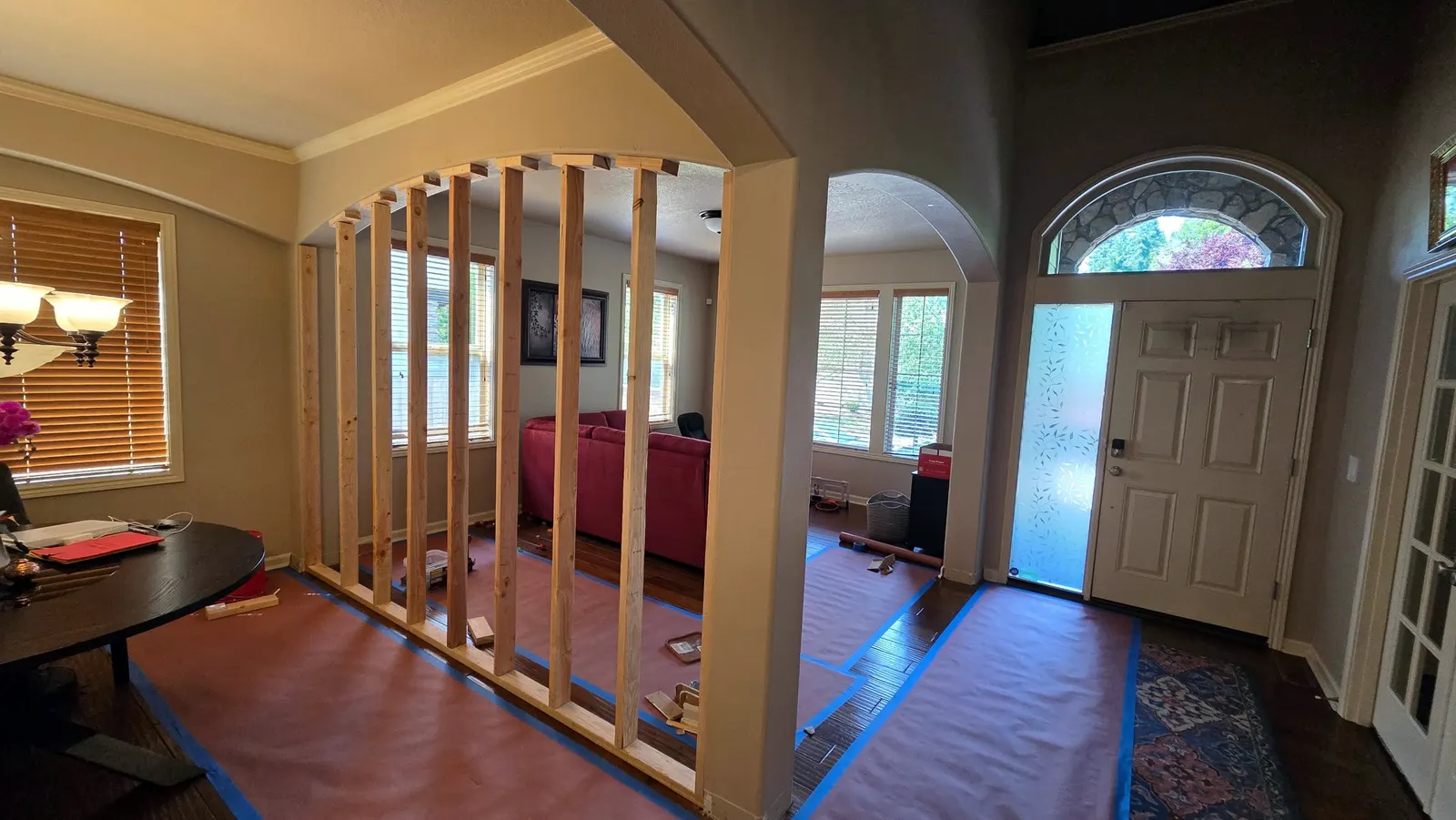 Before: open archway closed in with a new framed wall